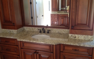 granite bathroom vanity with a single sink